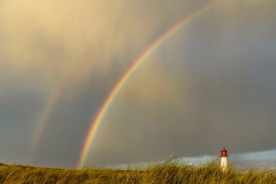 Lighthouse List-ost, in dune landscape with rainbow, Ellenbogen, List, island Sylt, Germany, Europe