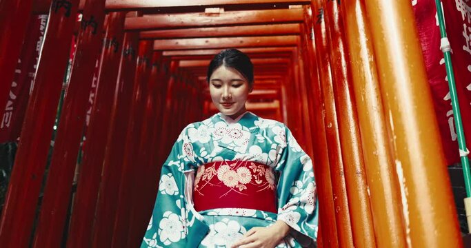 Japan, woman and face in kimono in shinto temple and religion ceremony and walking on stairs in heritage. Person, portrait and traditional clothes in tokyo culture and spiritual path in city in faith