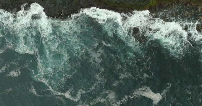 Aerial Top Forward Beautiful View Of Splashy Sea Waves On Wet Cliff - Faroe Islands, Denmark