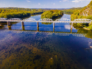 Transport bridge over the Potomac River on the border of Virginia and Maryland. Aerial view of nature and traffic