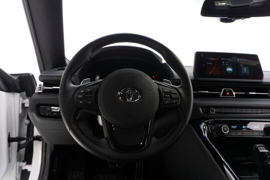 Toyota Supra Mk.V steering wheel, car in studio, white background - High Resolution Image