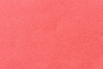red paper background texture light rough textured spotted blank copy space background in red , pink