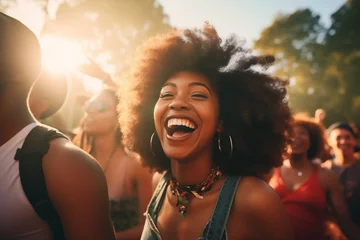 Tuinposter Afro american girl enjoying a music festival with friends © josepperianes