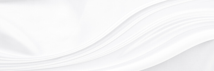 White gray satin texture that is white silver fabric silk panorama background with beautiful soft blur pattern natural.