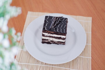 Delicious chocolate cake on a white plate