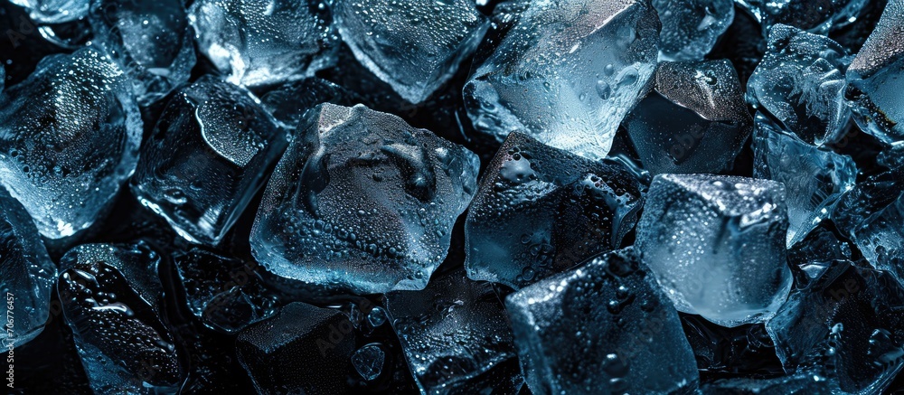 Poster pieces of crushed ice cubes on black background empty space in the center in form of a bottle. with 