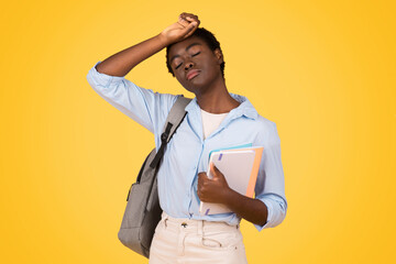 A black woman student, visibly tired and sweating, depicts exhaustion