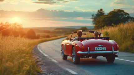 Fototapeten people riding in a convertible car to porto sol © adelton