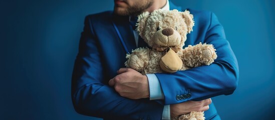 older man in suit snuggles with a stuffed animal blue suit pedophile. with copy space image. Place...