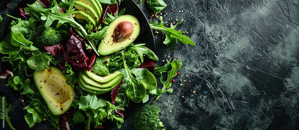 Poster salad mix with avocado and cucumber with balsamic dressing. with copy space image. place for adding 