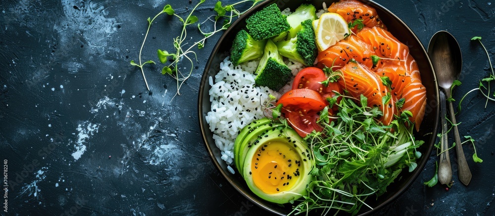 Poster salmon avocado bowl with broccoli green peas rice and fresh salad healthy food top view. with copy s