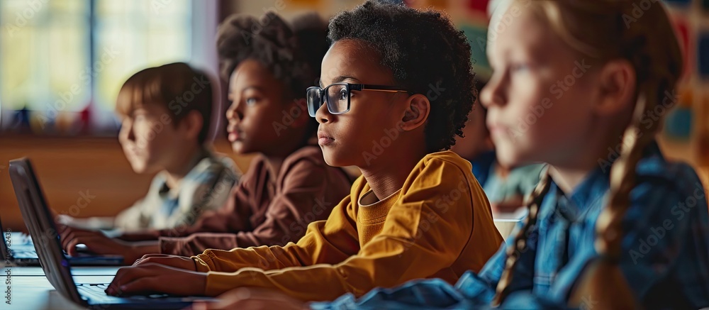 Poster smart children pupil pointing at laptop screen while discussing media material or online project wit