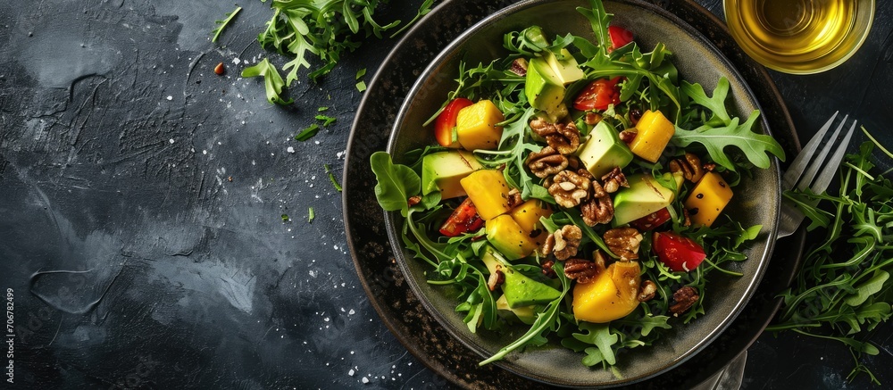 Aufkleber Salad with mango avocado arugula and walnuts. with copy space image. Place for adding text or design