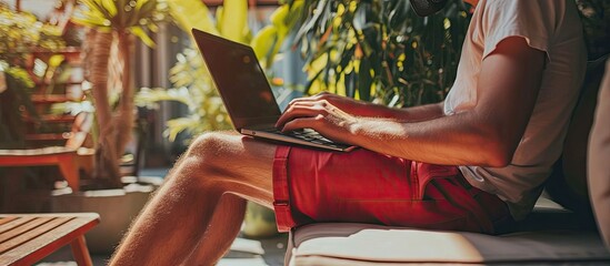 Online work at home Funny fat businessman in red shorts works communicates using laptop at home. with copy space image. Place for adding text or design - obrazy, fototapety, plakaty
