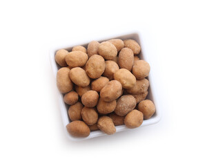 Delicious salted peanuts isolated on white background.