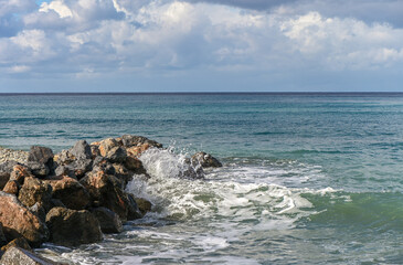 waves crashing on rocks near the shore on the Mediterranean Sea 11