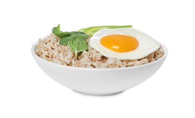 Tasty boiled oatmeal with fried egg, avocado and basil isolated on white
