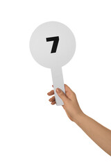 Woman holding auction paddle with number 7 on white background, closeup