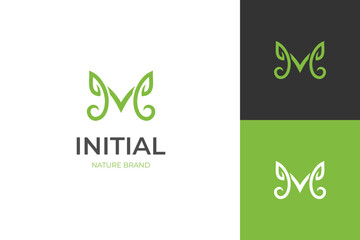 abstract leaf letter M logo icon design with grow graphic concept for nature biology identity logo template - obrazy, fototapety, plakaty