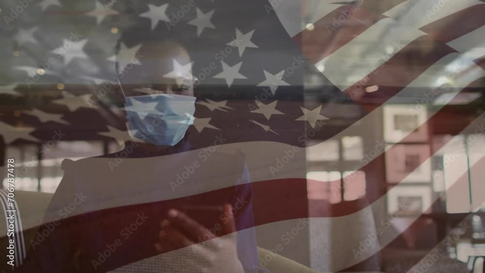 Sticker Animation of american flag over african american woman in face mask using smartphone