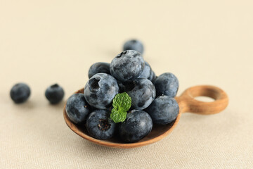 Juicy and fresh Blueberries with Mint Leaves.