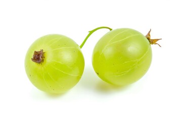 Two green grapes are shown next to each other on a white surface.