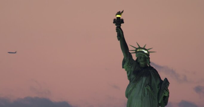 Close-up of Illuminated Statue of Liberty and Pink Sky