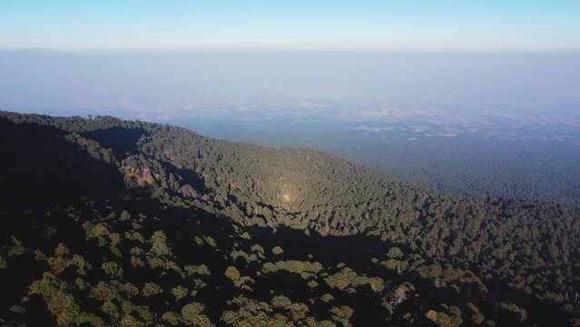 Aerial flyover La Malinche Forest Volcano in Puebla during sunset time in Mexico