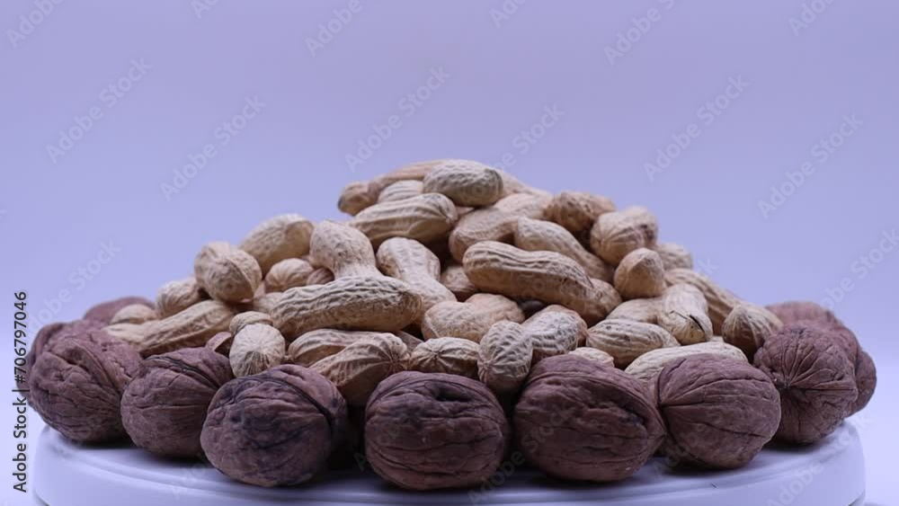 Poster walnuts and peanuts rotating on a turntable.