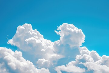 Naklejka na ściany i meble Fluffy white clouds in a bright blue sky