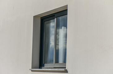 window in a residential complex on a light wall 2