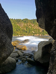 Long exposure of waves on rocky beach in East Java, Indonesia