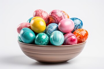 Fototapeta premium A basket with beautiful colored eggs on a white background.