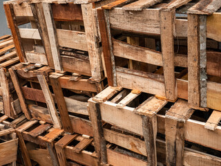 piles of empty wooden boxes in traditional markets