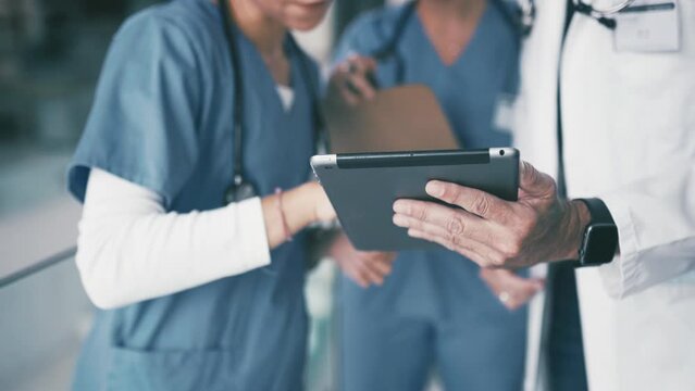People, doctor and hands pointing on tablet with nurses or medical team together at hospital. Closeup of healthcare employees or practitioners with technology in group meeting with surgeon at clinic