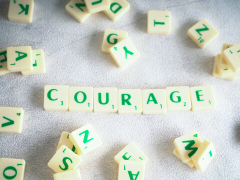 Scrabble letters  spelling words  Courage
