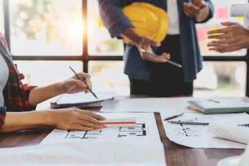 Architect or engineer are meeting to discuss house designs, modify plans for construction projects, and additions according to customer needs. - Powered by Adobe