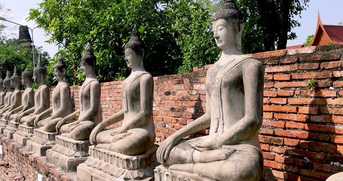 Row of buddha statues at Wat Yai Chaimongkol,Wat Yai Chai Mongkhon, Ayutthaya, Thailand