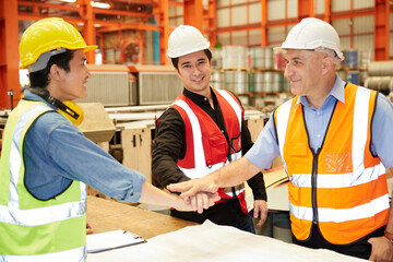 workers joining hands for cooperation success work and project in the factory