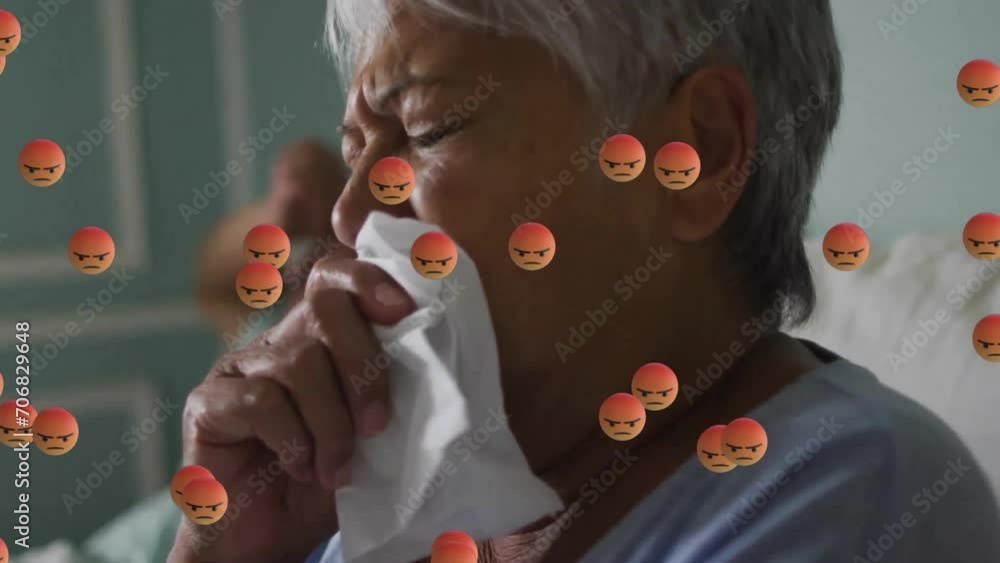 Poster Animation of emoji icons over senior biracial woman with runny nose in bed