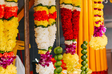 Colorful jewelry made of real flowers at the Indian market. Decor for an Indian holiday