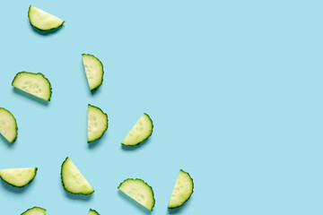 Slices of cucumber on turquoise background