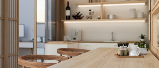 Close-up image of a hardwood dining table in a beautiful modern home dining room. side view