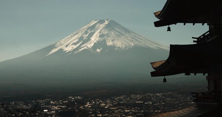 Chureito Pagoda, Mount Fuji and city in morning with temple, trees and blue sky on travel. Japanese...