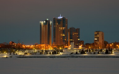 Russia Samara March 3, 2011: Embankment of the Volga River against the backdrop of the Ladya residential complex on a winter night.