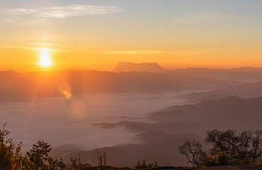 Beautiful Misty Morning with Beautiful Sunrise which clear blue orange sky in morning at doi luang...