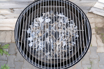 Prepared grill with hot charcoal