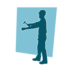 Silhouette of a worker carrying hammer tool. Silhouette of a worker in action pose using hammer tool.