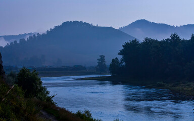 beautiful Ural river Belaya in the morning fog at dawn in summer