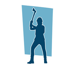 Silhouette of a worker in action pose using his axe tool.
